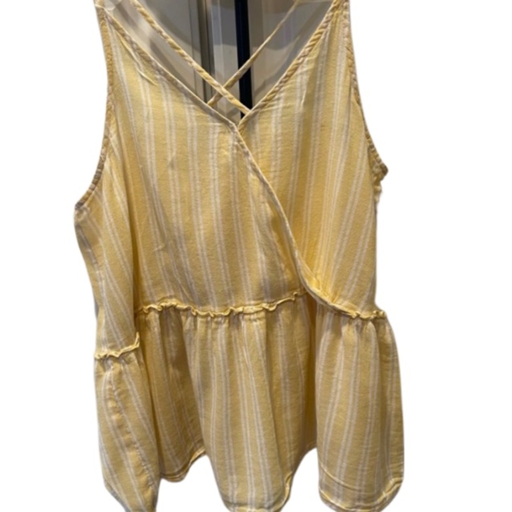 Darling yellow and white sleeveless blouse.